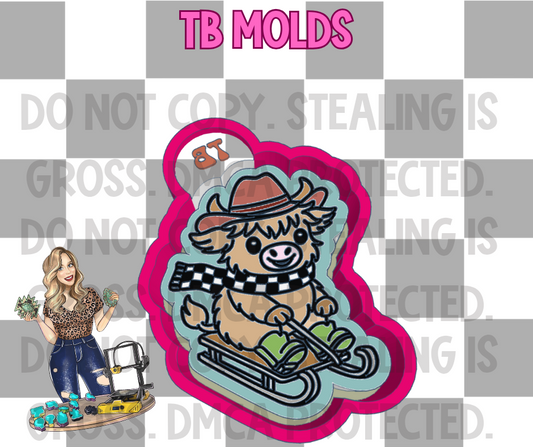 Sledding Highland cow exclusive