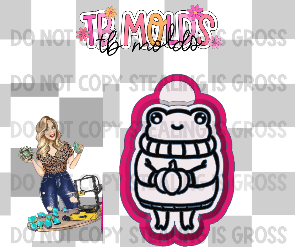 Frog holding pumpkin