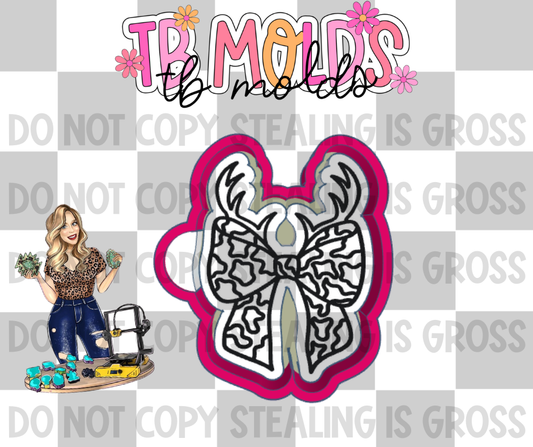 Camo bow with antlers